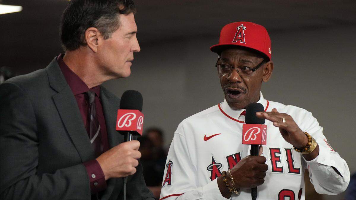 Nov 15, 2023; Anaheim, CA, USA; Los Angeles Angels manager Ron Washington (right) is interviewed by Bally Sports commentator Mark Gubicza at introductory press conference at Angel Stadium of Anaheim. Mandatory Credit: Kirby Lee-USA TODAY Sports