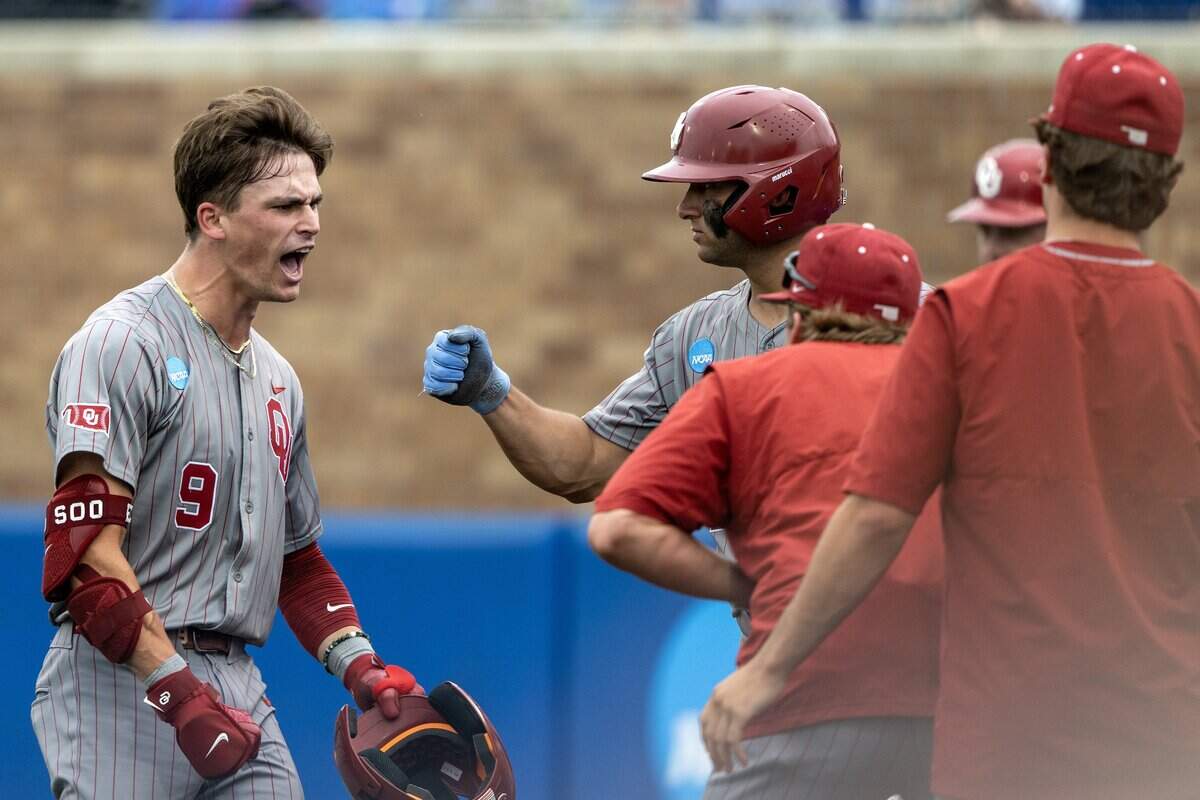 Oklahoma infielder Camden Johnson (9) celebrates after hitting a two-run home run against Kansas in the fifth inning of an NCAA Tournament baseball game at Hoglund Ballpark on Saturday, June 6, 2026, in Lawrence.