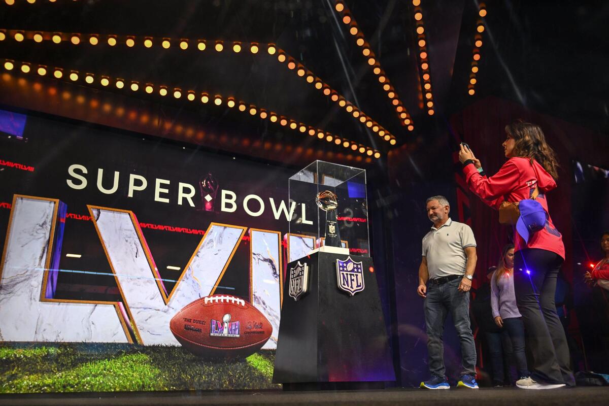 Football fans viewed and took photos of the Lombardi Trophy on display at the Super Bowl Experience, on Thursday, Feb. 8, 2024, in Las Vegas, Nevada.