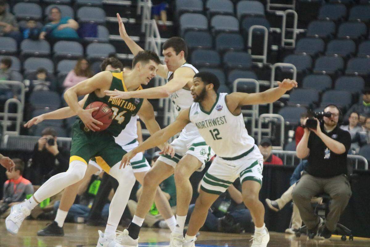 Northwest Missouri State guard Trevor Hudgins and forward Ryan Hawkins guard Point Loma’s Daulton Hommes in the NCAA Division II National Championship Game on Saturday at the Ford Center in Evansville, Ind. Hommes was named the NABC Division II Player of the Year on Thursday.