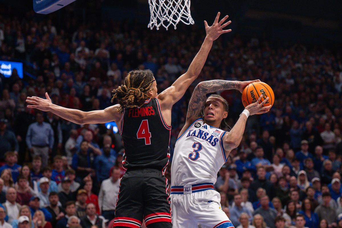 Kansas Jayhawks guard Tre White (3) drives into the lane for a layup in the second half of the Jayhawks game vs. the Houston Cougars on Monday, February 23, 2026, at Allen Fieldhouse.