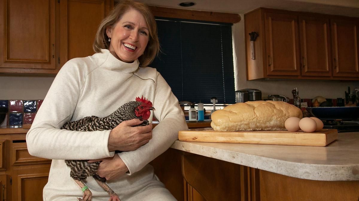 Debra Hannah, of Olathe, with one of her chickens, Rosie Mae, shares her recipe for French bread.