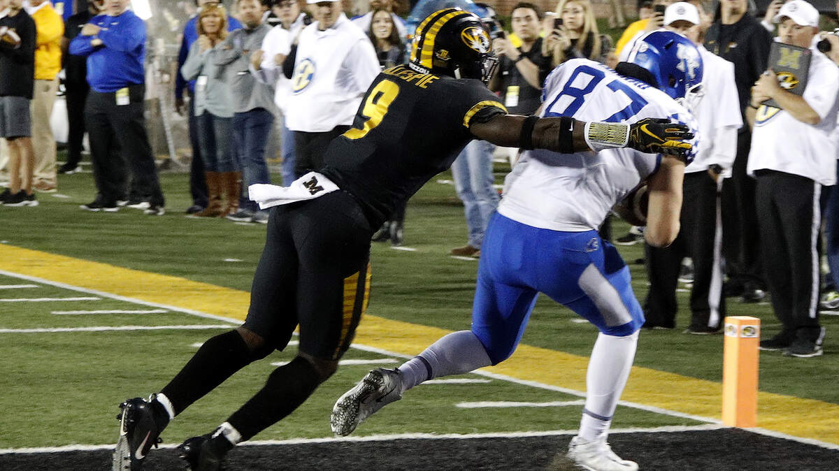 Kentucky tight end C.J. Conrad beat Missouri safety Tyree Gillespie (left) for a reception in the end zone  with no time left on the clock to win 15-14 on Saturday in Columbia.