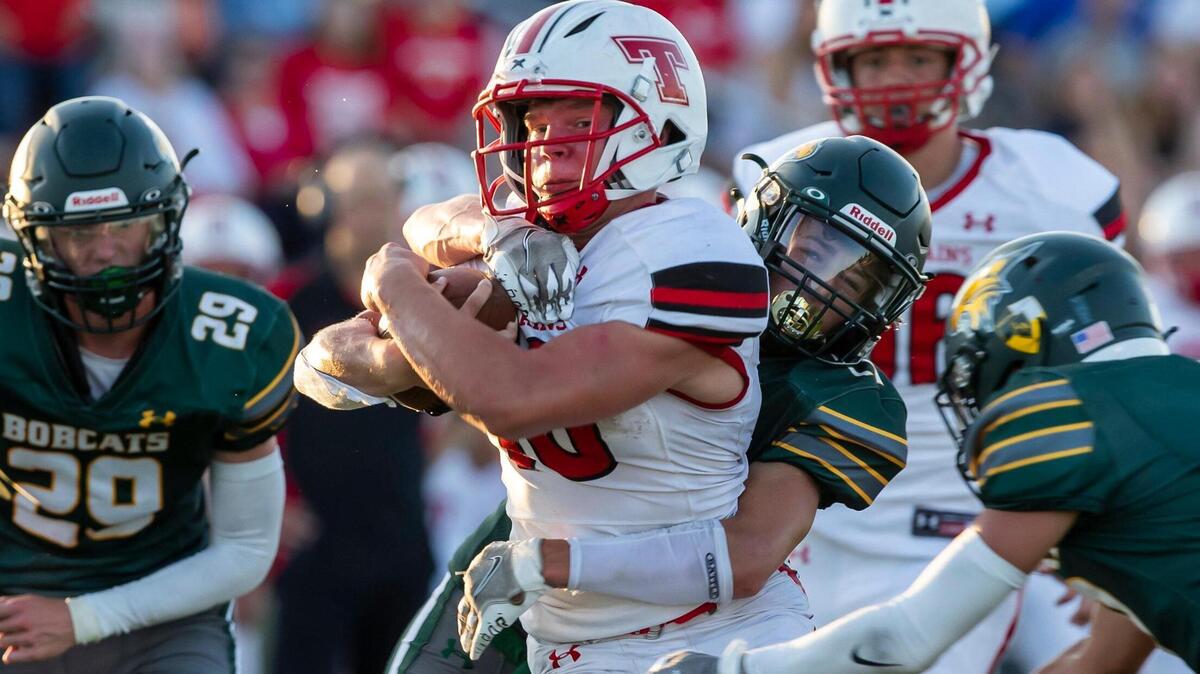 Tonganoxie running back Colton Brusven attempts to power through the Basehor-Linwood defense during Friday night’s game at Basehor.