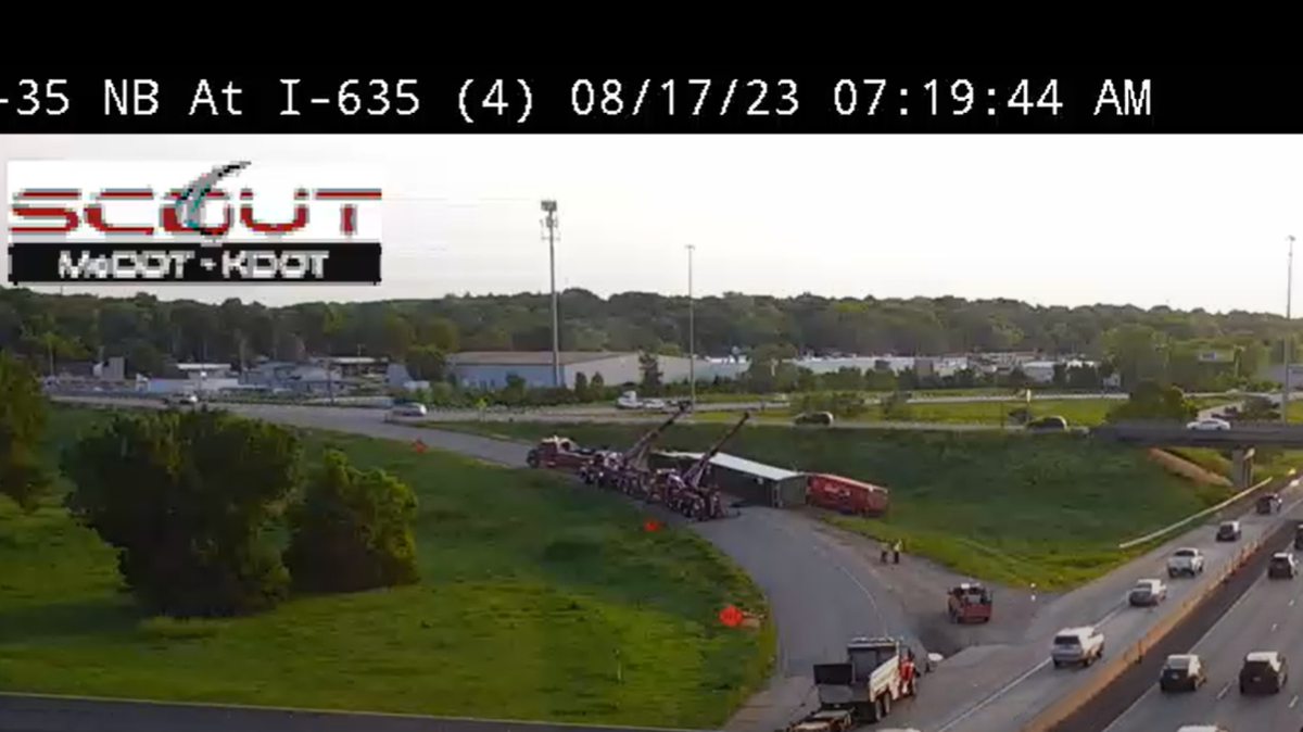 Crews are working to remove an overturned semi-truck that has closed an exit ramp from northbound Interstate 35 to Interstate 635 in Johnson County.
