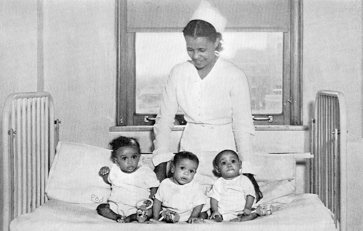 A nurse looks over triplets born in General Hospital No. 2 in 1939.