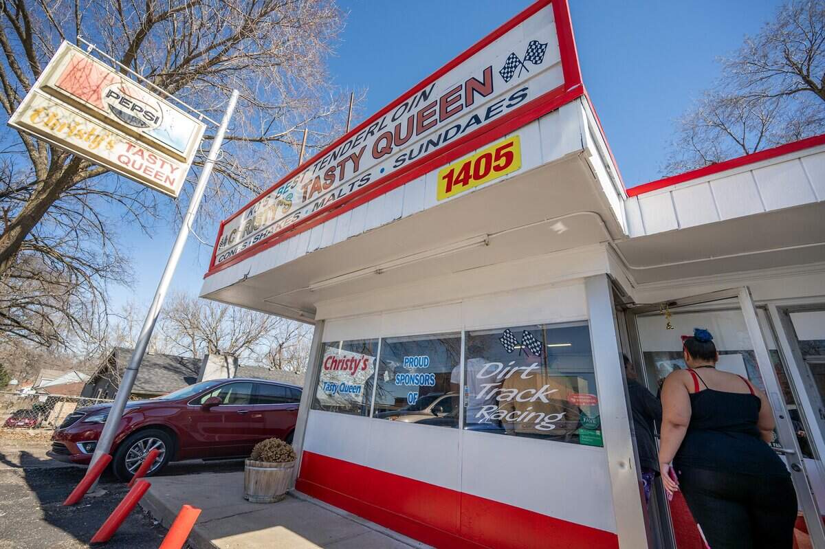 Customers line up outside Christy's Tasty Queen on Wednesday, Feb. 18, 2026, in Kansas City, Kansas. Customers gather for the restaurant's final days under its founding owners.