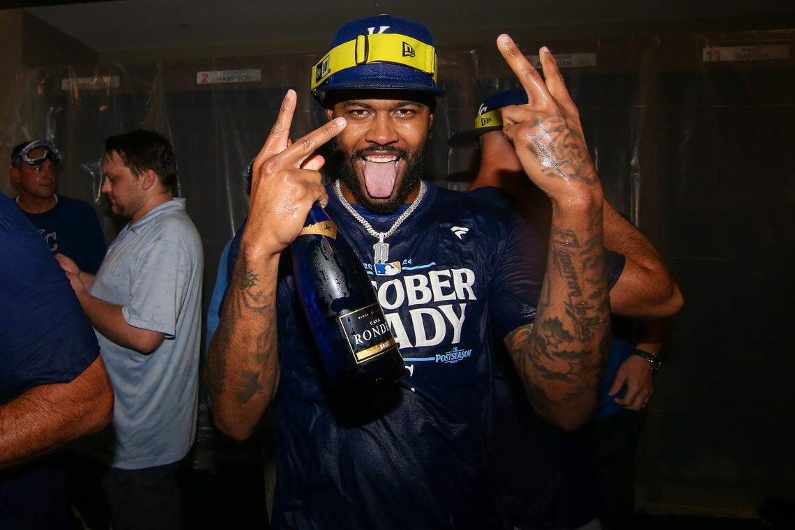 Kansas City Royals third baseman Maikel Garcia (11) celebrates after clinching a wild card playoff birth after a game against the Atlanta Braves at Truist Park.