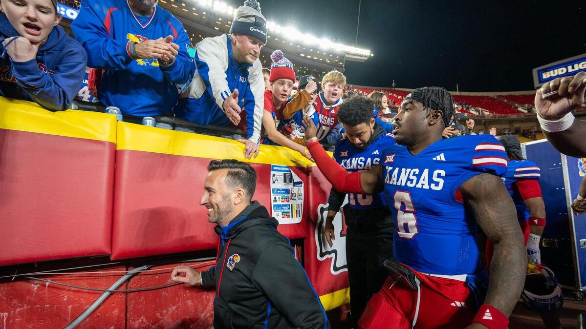 Kansas players, including quarterback Jalon Daniels (6), leave the field after a win over Colorado at GEHA Field at Arrowhead Stadium on Saturday, Nov. 23, 2024, in Kansas City.