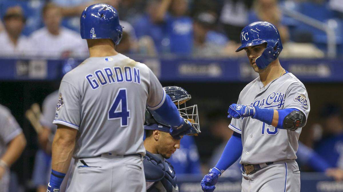 The Kansas City Royals’ Whit Merrifield (15) is congratulated by teammate Alex Gordon (4) after hitting solo home run in the fourth inning against the Tampa Bay Rays on Wednesday, Aug. 22, 2018, at Tropicana Field in St. Petersburg, Fla.