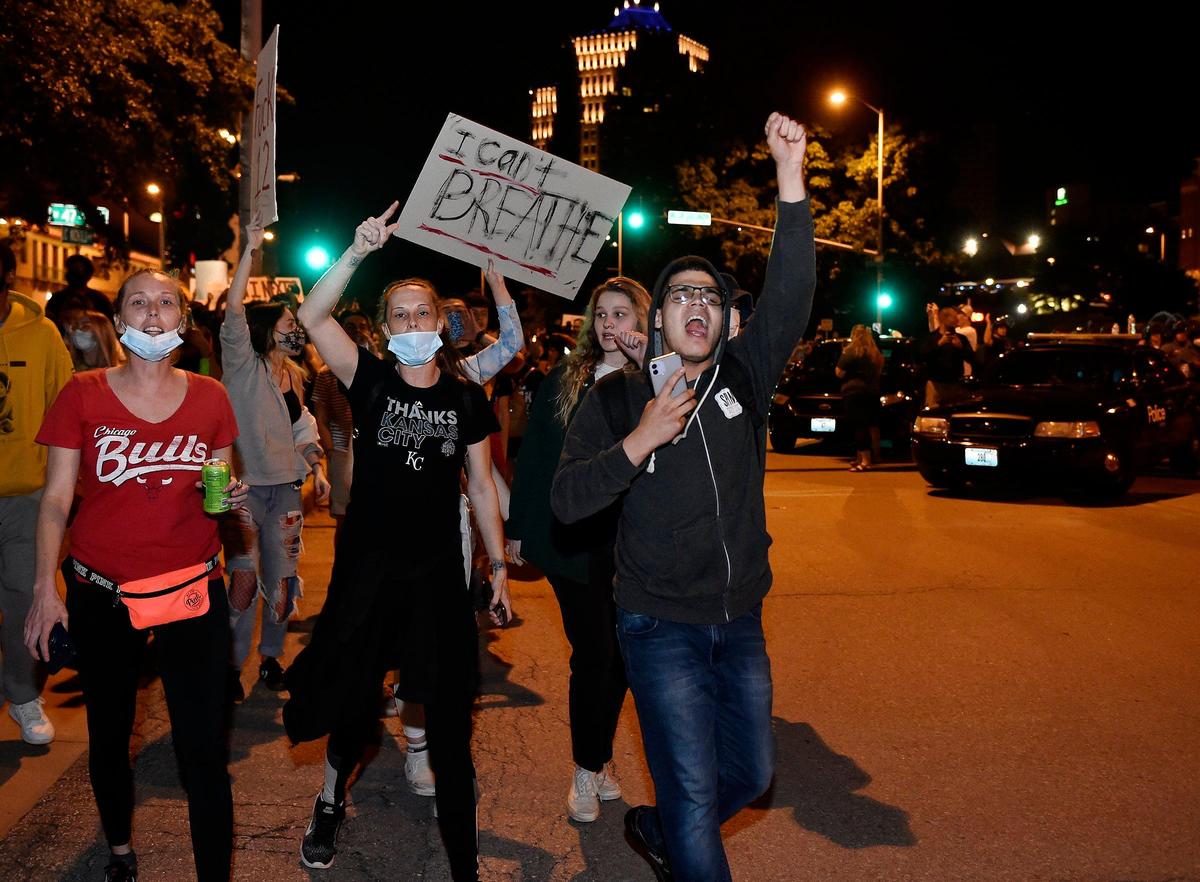 Protesters marched and chanted through the Country Club Plaza.