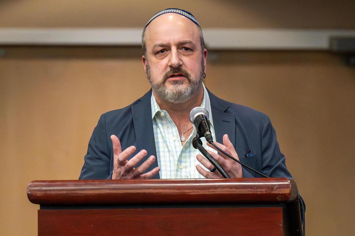 Rabbi Neil Schuster speaks during a vigil for Sarah Milgrim and Yaron Lischinsky at the Social Hall of the Jewish Community Center on Thursday, May 22, 2025, in Overland Park. Milgrim and Lischinsky were killed outside the Capital Jewish Museum in Washington, D.C., on Wednesday, May 21.