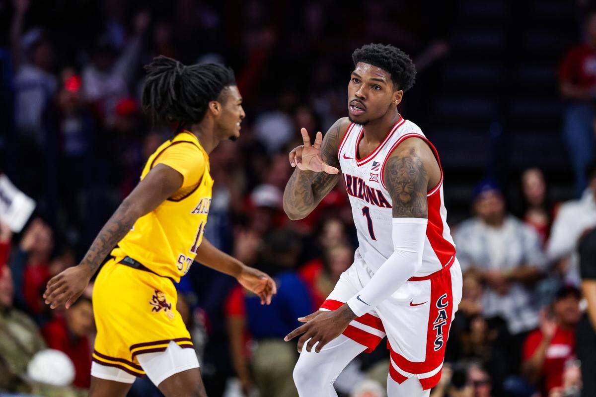 Arizona Wildcats guard Caleb Love (1) holds up three fingers after shooting a 3-point shot during the first half against Arizona State at McKale Center on March 4, 2025.
