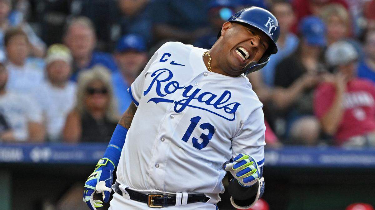 Royals designated hitter Salvador Perez winces after getting hit with a pitch during the third inning of Wednesday’s game against the Cincinnati Reds at Kauffman Stadium.