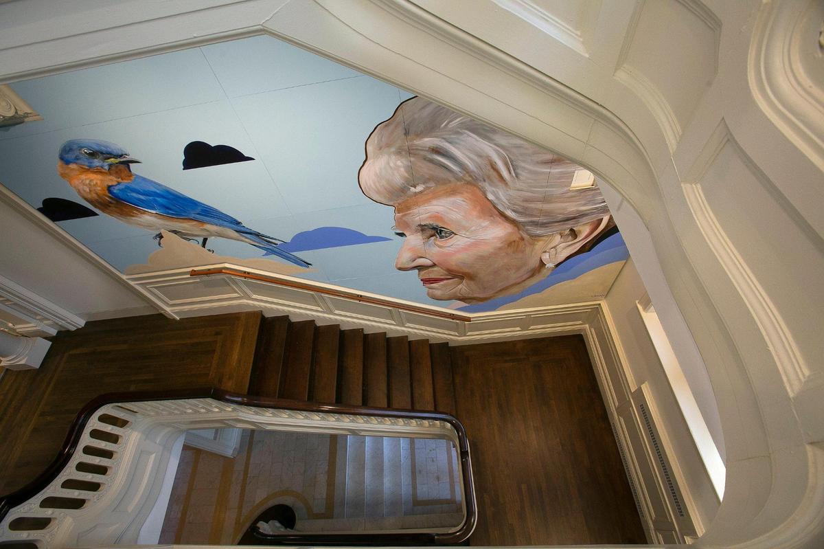 A portrait of SuEllen Fried by Artist Zac Laman graces the west stairway at the Kansas City Museum.