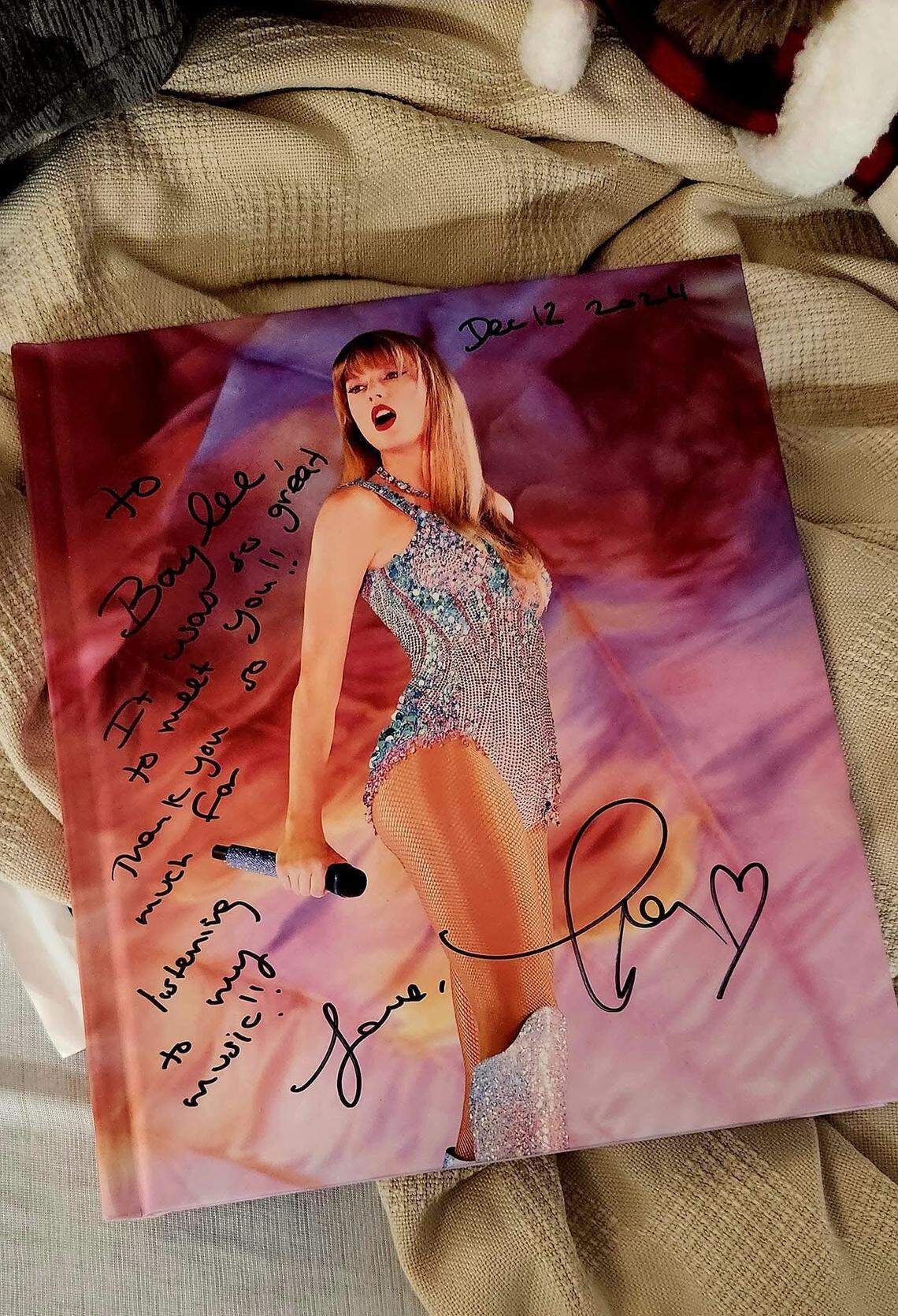 Swift gave Baylee this autographed copy of her Eras Tour book.
