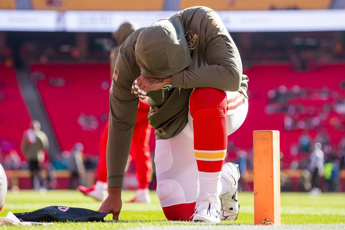 Kansas City Chiefs offensive tackle Orlando Brown Jr. (57) takes a prayer in the endzone during warmups prior to the game between the Kansas City Chiefs and the Jacksonville Jaguars on Sunday November 13, 2022 at Arrowhead Stadium in Kansas City, Missouri.