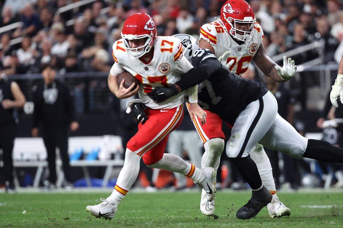 Kansas City Chiefs quarterback Shane Buechele (No. 17) is tackled by the Raiders’ Tonka Hemingway during an NFL Week 18 game at Allegiant Stadium in Las Vegas on Sunday, January 4, 2026.
