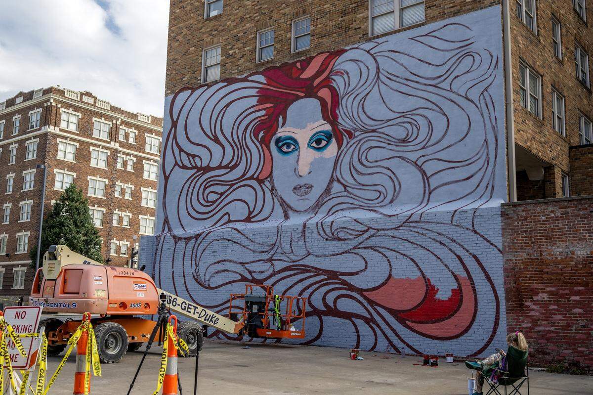 A mural of pop singer Chappell Roan takes shape along Broadway Boulevard on Wednesday, Sept. 24, 2025, in Kansas City. Artists Christine Riuzel and Jared Horman are collaborating on the project.