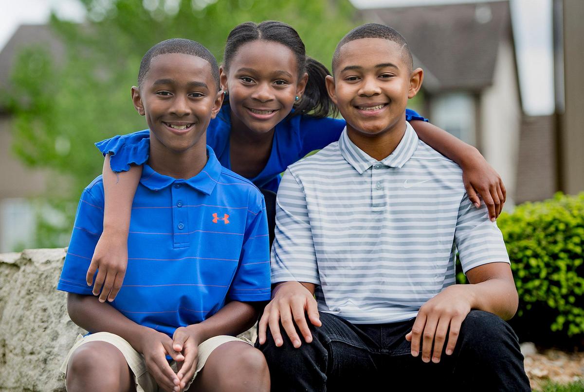 Siblings Aaron, 11, (from left) Alexis, 7 and Isaac McIntosh, 13, are quarantining together at home with their parents in Lee’s Summit.
