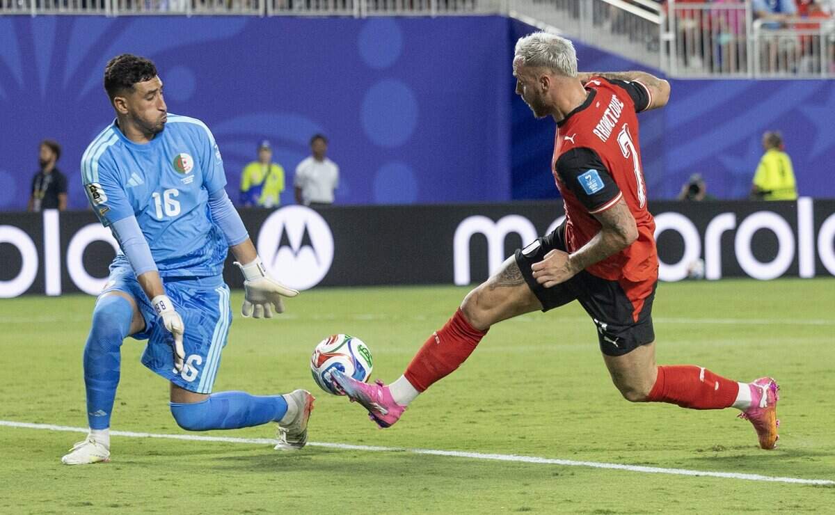 Austria forward Marko Arnautovic (7) scores a goal against Algeria goalkeeper Oussama Benbot (16) during a FIFA World Cup group-stage soccer match at Kansas City (Arrowhead) Stadium in Kansas City on Saturday, June 27, 2026.