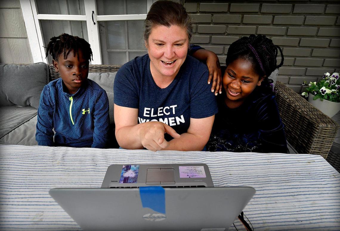 Michelle Millard had a full slate of summer camps and other activities planned for her children, Will, 10, and his sister, Nathalie, 8. But all that got canceled due to the coronavirus outbreak. She now has to juggle her job responsibilities and take care of her children. During a recent spring day, they watched a digital yearbook put together by their school.