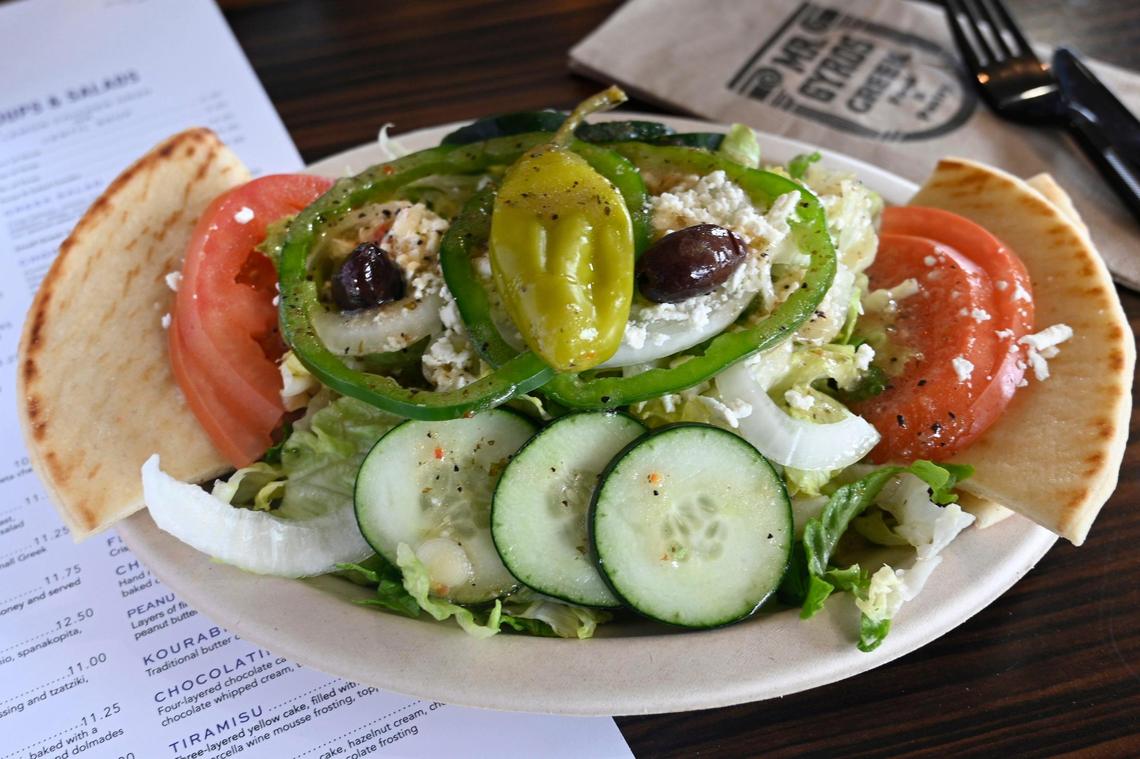 A large Greek salad at Mr. Gyro’s comes with lots of veggies and crumbled feta cheese, tangy dressing and slices of pita.