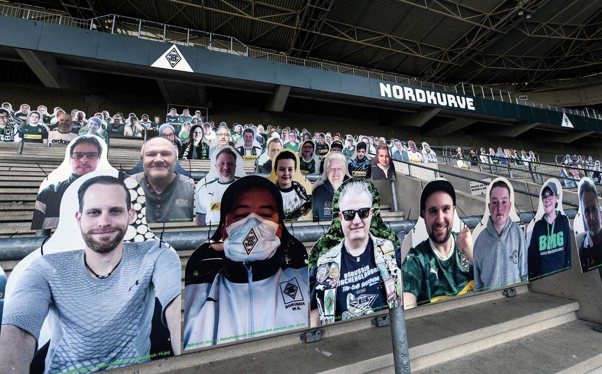 Fan portraits are set on the supporters tribune of German Bundesliga soccer club Borussia Moenchengladbach at the stadium in Moenchengladbach, Germany, Thursday, April 16, 2020. All major events in Germany are suspended due to the coronavirus outbreak until the end of August, the German Bundesliga suspended all matches until April 30, 2020. (AP Photo/Martin Meissner)