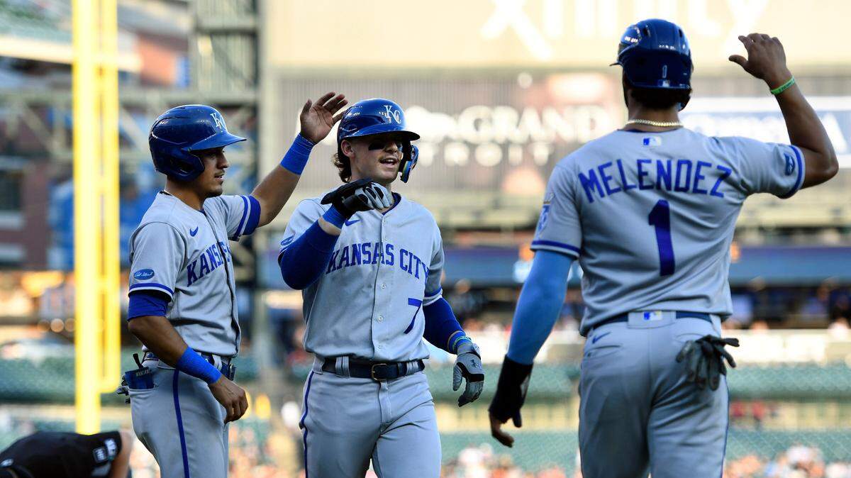 Kansas City Royals’ Bobby Witt Jr., middle, is congratulated after hitting a three-run home run scoring Nicky Lopez, left, and MJ Melendez in the third inning of a baseball game against the Detroit Tigers, Saturday, Sept. 3, 2022, in Detroit. (AP Photo/Jose Juarez)