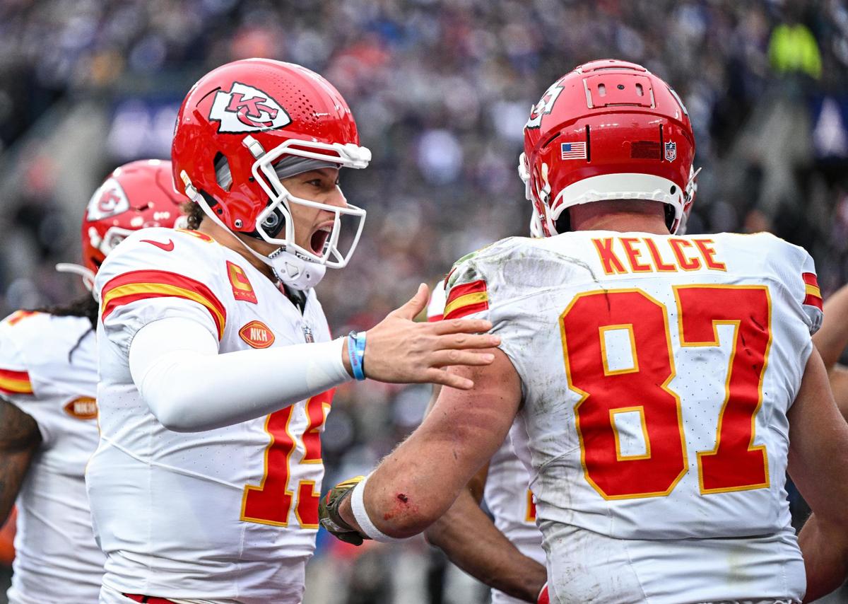 Kansas City Chiefs quarterback Patrick Mahomes (15) celebrates with tight end Travis Kelce (87) after Kelce pulled in a catch for touchdown in the first quarter against the Baltimore Ravens Sunday, Jan. 28, 2024, during the AFC Championship Game in Baltimore.
