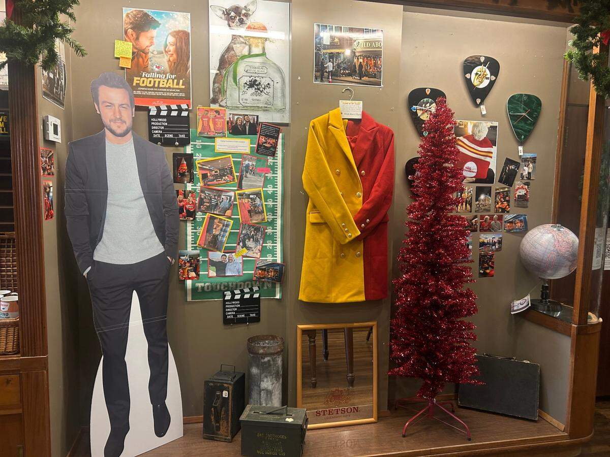Mementos from “Holiday Touchdown: A Chiefs Love Story” hang on the walls of Wild About Harry in Independence.