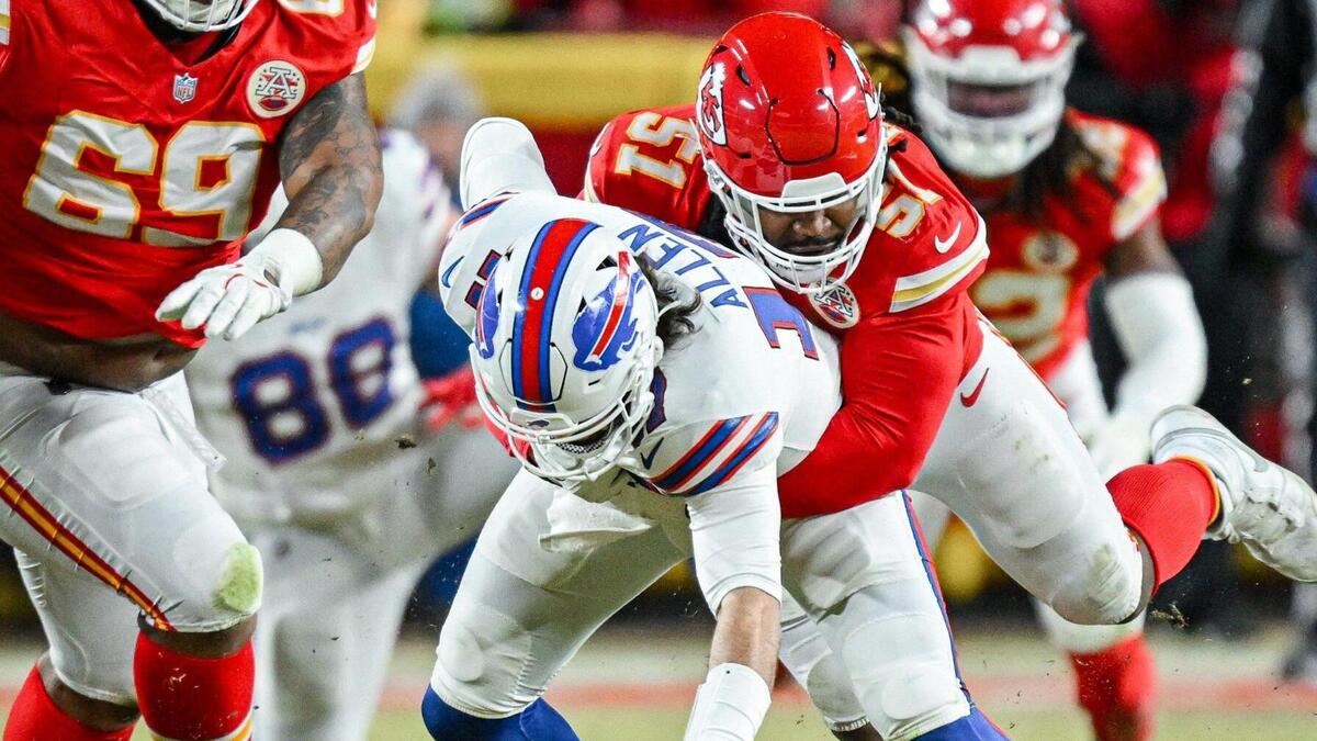Kansas City Chiefs defensive end Mike Danna (51) forces Buffalo Bills quarterback Josh Allen (17) to drop the ball in the second quarter during the AFC Championship Game on Sunday, Jan. 26, 2025, at GEHA Field at Arrowhead Stadium.