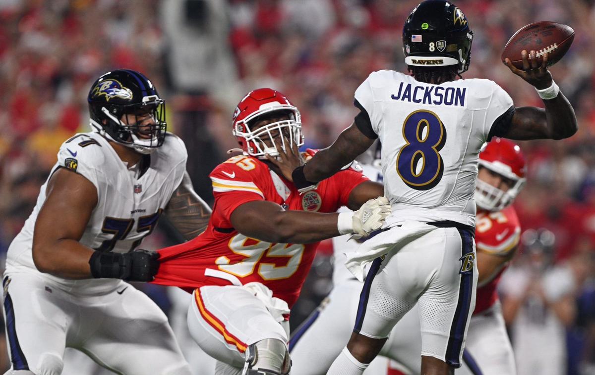 Baltimore Ravens offensive tackle Daniel Faalele holds onto Kansas City Chiefs defensive tackle Chris Jones while he gets quarterback Lamar Jackson in his grasp in the first half Thursday, Sept. 5, 2024, at GEHA Field at Arrowhead Stadium.