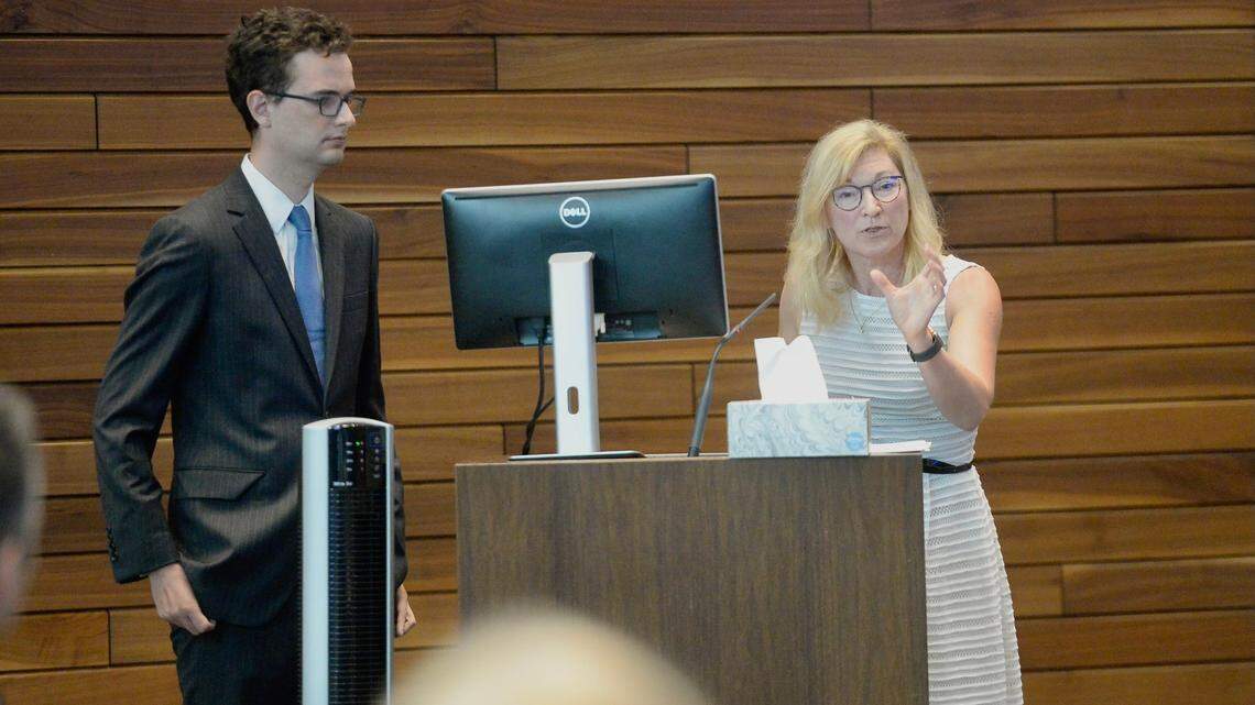 Jackson County Prosecutor Jean Peters Baker, right, pictured speaking at the Kansas City Board of Police Commissioners meeting. Pictured at left is Henry Chapman, a data analyst for the prosecutor’s office.