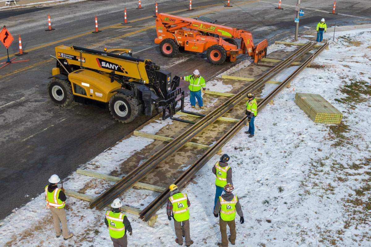 In early 2022, 458 sticks of rails, each 80 feet long and weighing 3,100 pounds, were delivered to the intersection of 27th and Main streets.