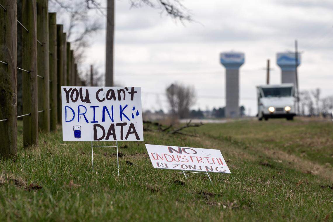 Picket signs are seen along Lackman Road on Saturday, March 7, 2026, in Spring Hill, Kansas.