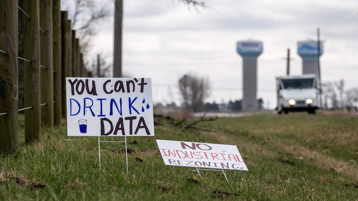 Picket signs are seen along Lackman Road on Saturday, March 7, 2026, in Spring Hill, Kansas.