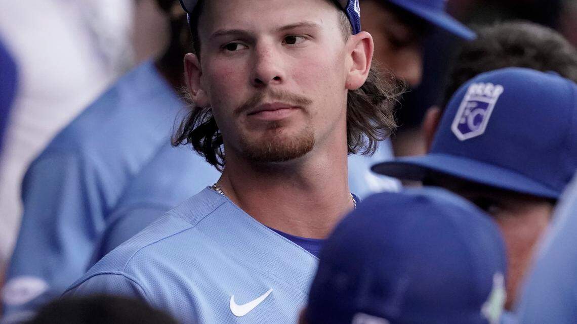 Kansas City Royals infielder Bobby Witt Jr. greets teammates in the dugout before a spring training game in Surprise, Ariz.
