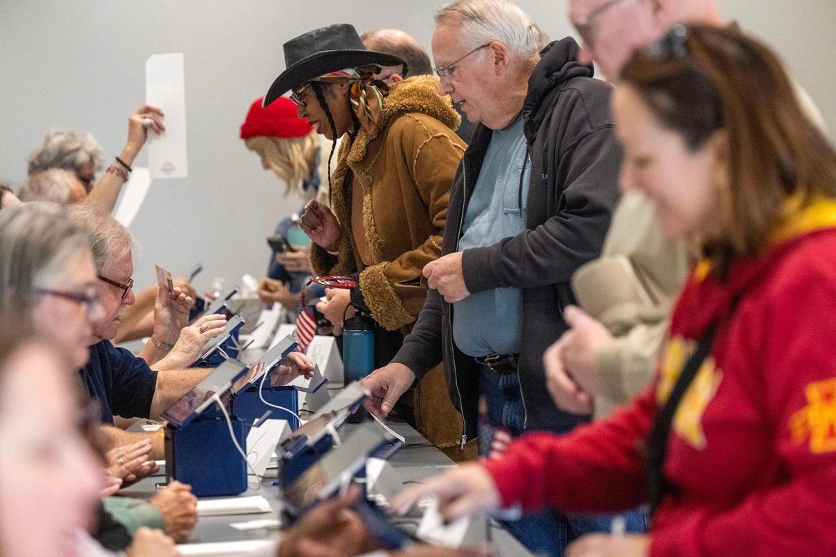 Within minutes of the doors opening, election workers were handling the large turnout of Johnson County residents arriving for the first day of in-person advance voting for the 2024 General Election at The Arts and Heritage Center in Overland Park on Saturday, October 19, 2024.