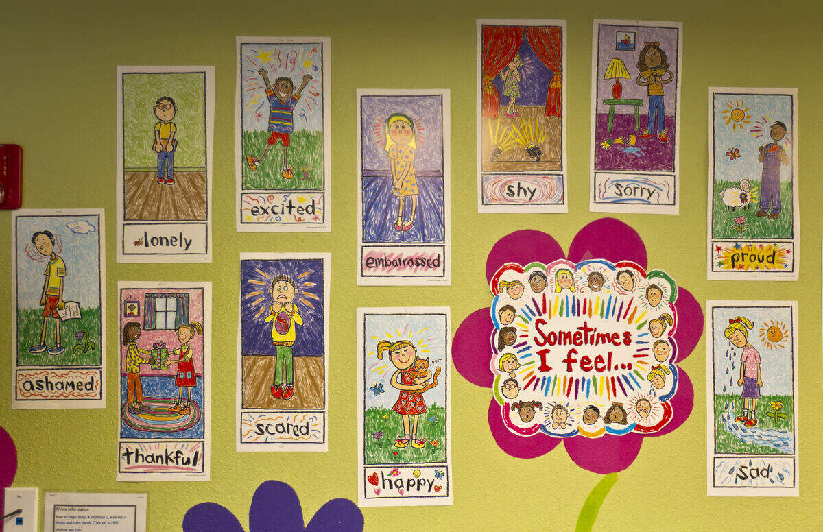 The walls inside the children’s center at SAFEHome in Overland Park feature pictures of emotions for children to point to for therapists at the home for domestic violence victims. 