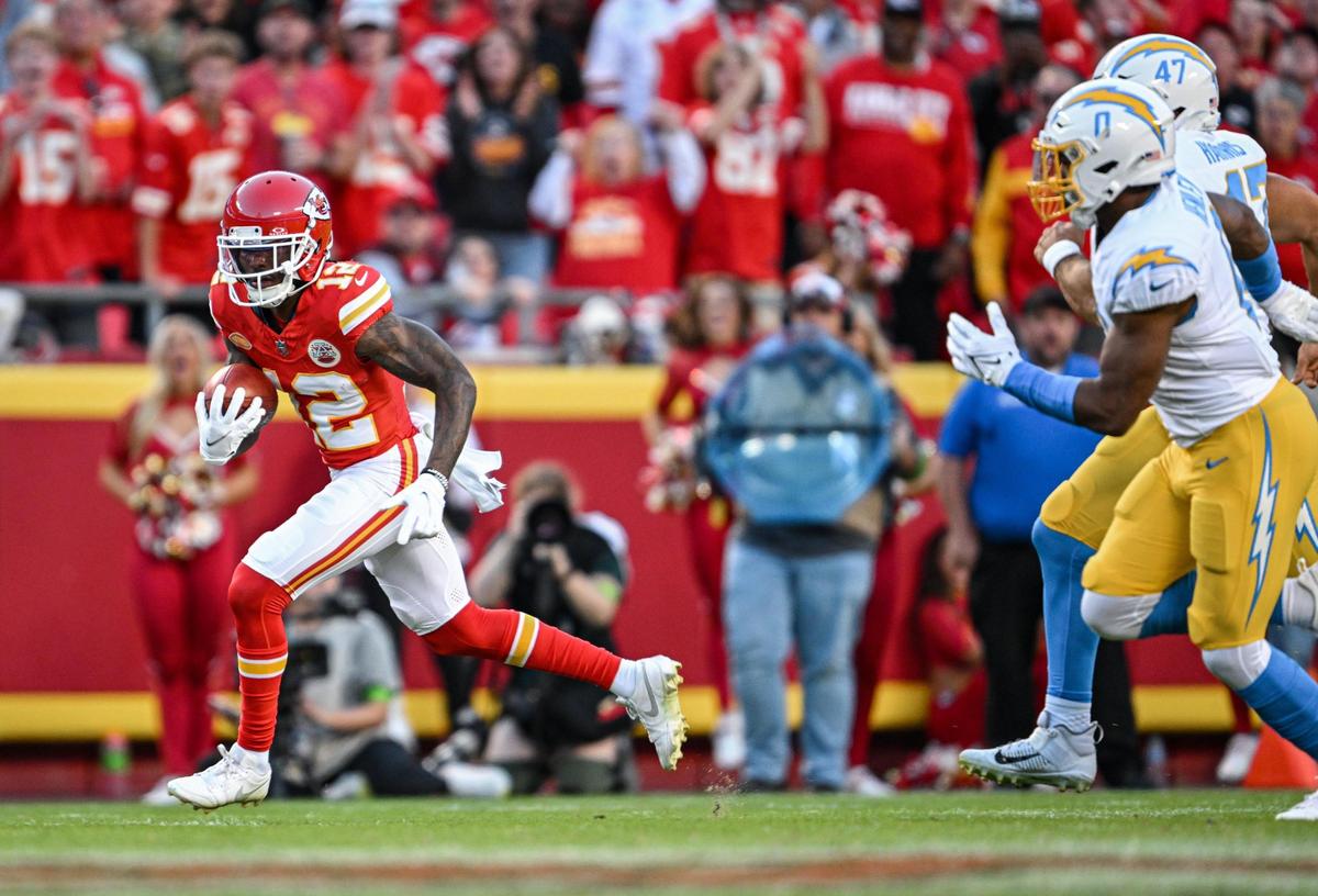 Kansas City Chiefs wide receiver Mecole Hardman Jr. (12) leaves Los Angeles Chargers defenders in the dust on a punt return in the fourth quarter Sunday, October 22, 2023, at GEHA Field at Arrowhead Stadium.