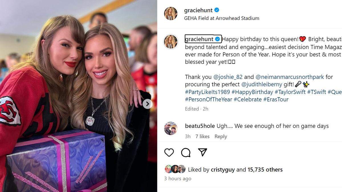 Gracie Hunt, right, and Taylor Swift with the birthday gift the Hunt family gave the pop superstar on Sunday at the Kansas City Chiefs-Buffalo Bills game at GEHA Field at Arrowhead Stadium.