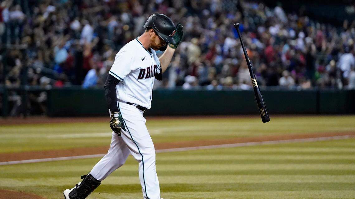 Arizona Diamondbacks’ Jordan Luplow flips his bat after hitting a three-run home run against the Kansas City Royals during the sixth inning of a baseball game Tuesday, May 24, 2022, in Phoenix. (AP Photo/Ross D. Franklin)