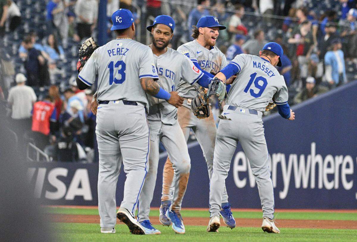 Kansas City Royals first baseman Salvador Perez (13), left fielder MJ Melendez (1), shortstop Bobby Witt Jr. (7) and second baseman Michael Massey (19) celebrate a win over the Toronto Blue Jays at Rogers Centre on April 30, 2024.