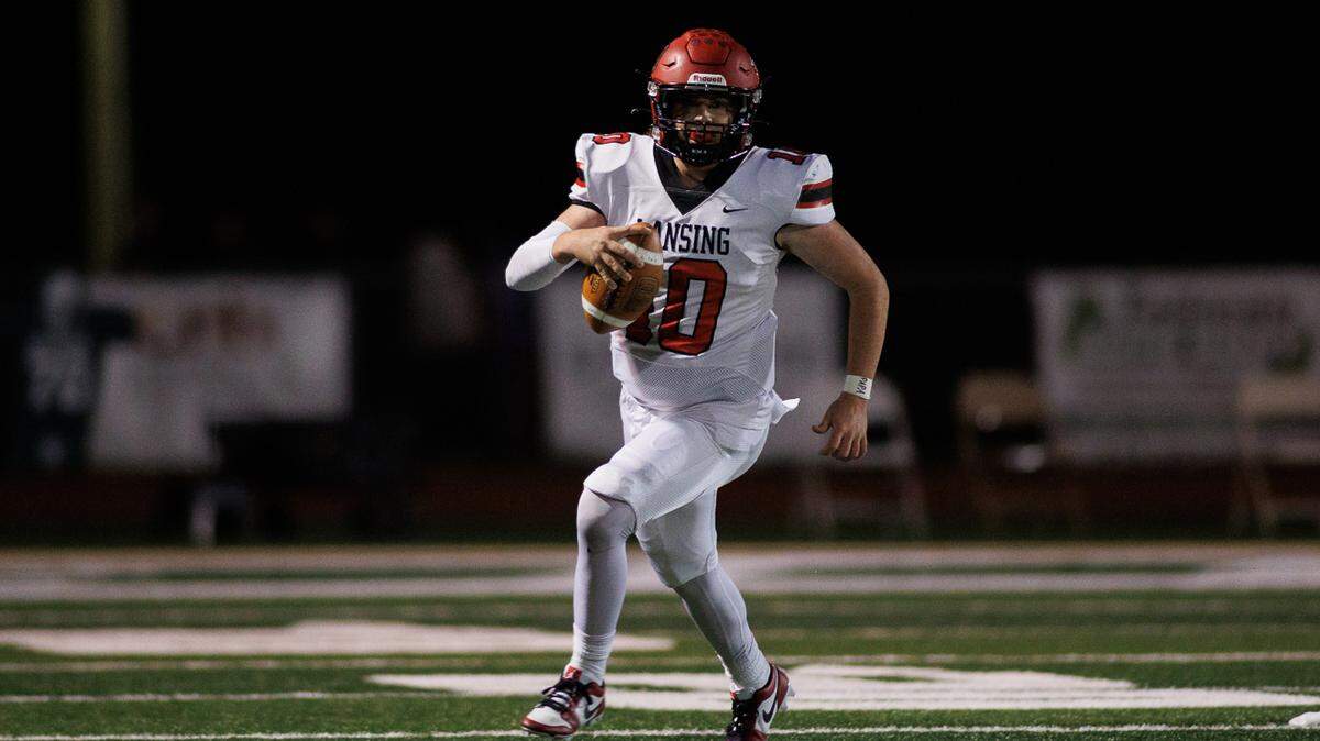 Lansing High School quarterback Dalton Jorgensen scrambles against Basehor-Linwood during a Kansas football showdown on Friday night.