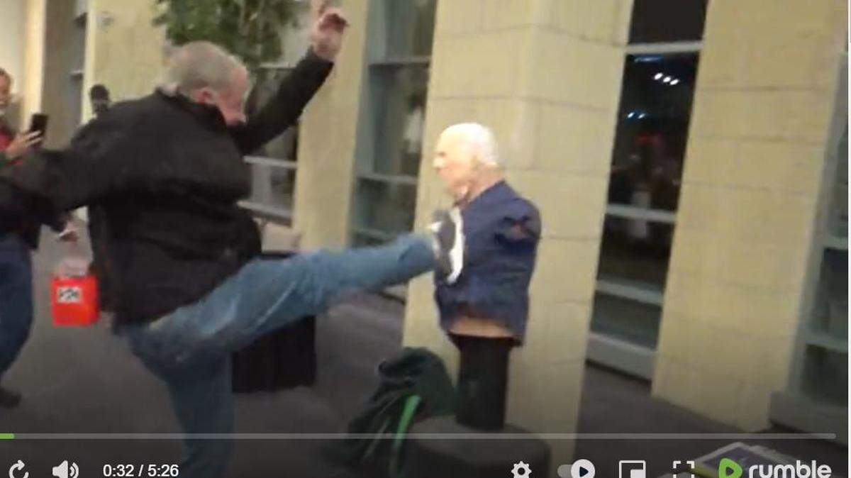 Attendees at a Johnson County Republican Party event punched and kicked an effigy of President Joe Biden on Friday.