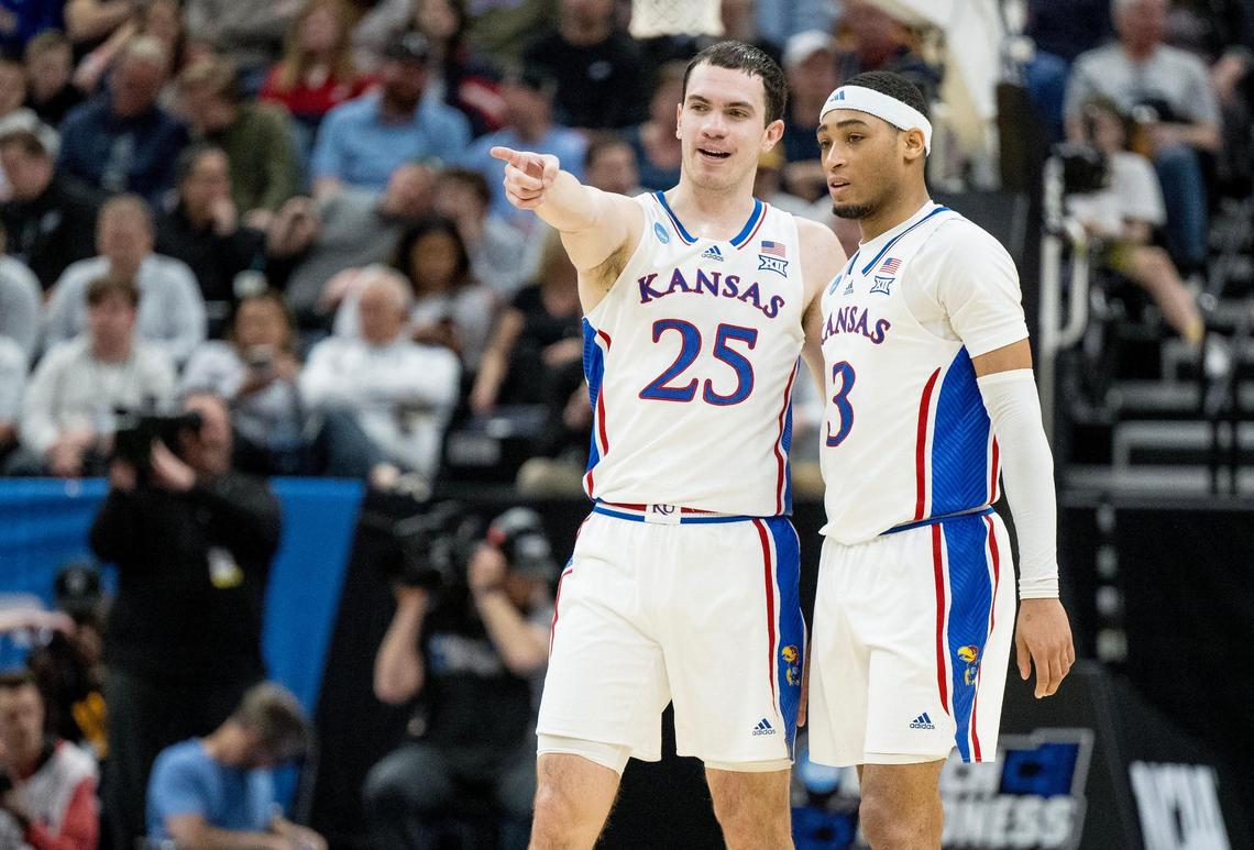 Kansas Jayhawks guard Nicolas Timberlake (25) talks with guard Dajuan Harris Jr. (3) during a men’s college basketball game against the Samford Bulldogs in the first round of the NCAA Tournament on Thursday, March 21, 2024, in Salt Lake City, Utah.