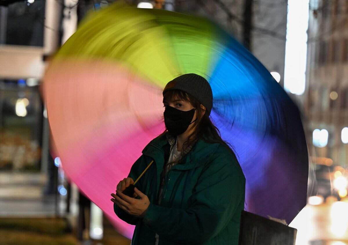 A protester twirls an umbrella as crowds rally against ICE at City Hall in Kansas City on Thursday, Jan. 8. An ICE agent shot and killed Renee Good, a former KC resident, in Minneapolis on Wednesday, Jan. 7.