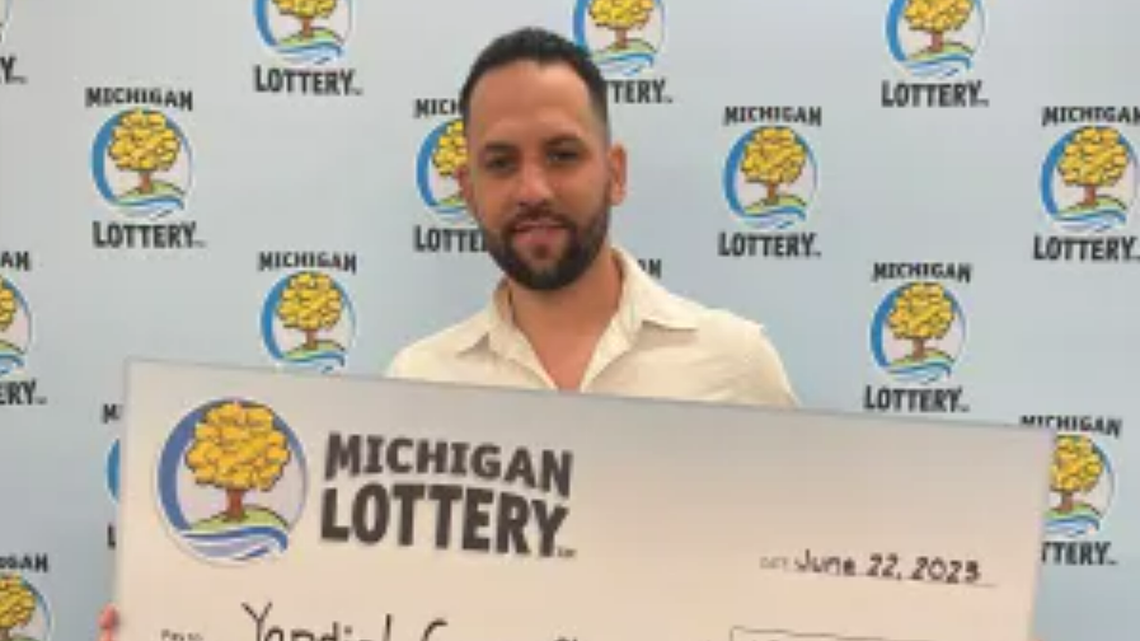 Yandiel Cruz-Chavez with his oversized check.