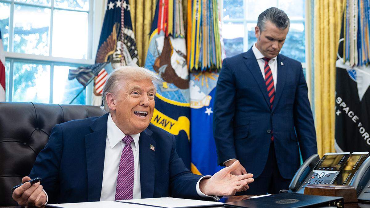 President Donald Trump speaks alongside Defense Secretary Pete Hegseth and Chairman of the Joint Chiefs of Staff Dan Caine as he signs an executive order for the Department of Defense to be renamed the Department of War in the Oval Office at the White House Sept. 5, 2025. (Francis Chung/Pool/Sipa USA)